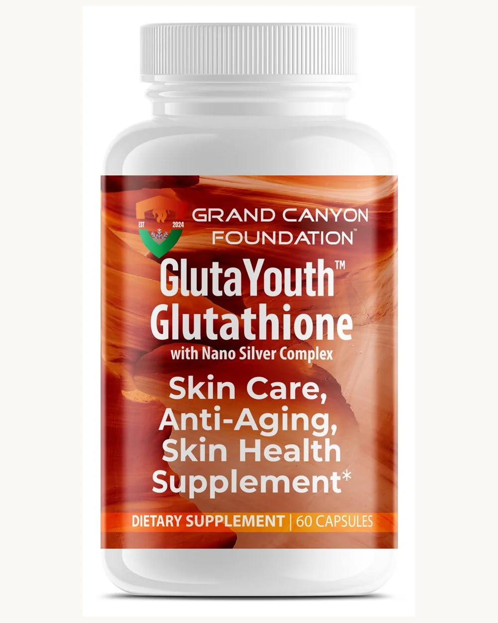 The GlutaYouth supplement bottle on a pale surface in soft directional light.